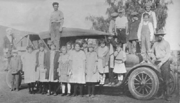 When motorized vehicles arrived for transporting students, George Gibson recalls riding in Beaker's School Bus with its cloth top flapping in the wind, and the frequent breakdowns. Wellington Hoover transported many students from the Lakeview area. 